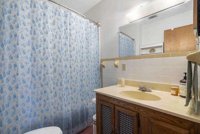 364 W Rd, Branson, MO 65616 - full bathroom featuring vanity, tile walls, and shower / tub combo