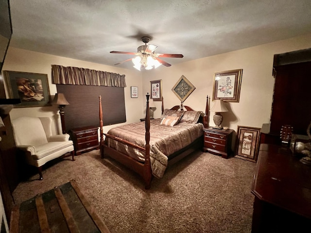 carpeted bedroom featuring ceiling fan and a textured ceiling