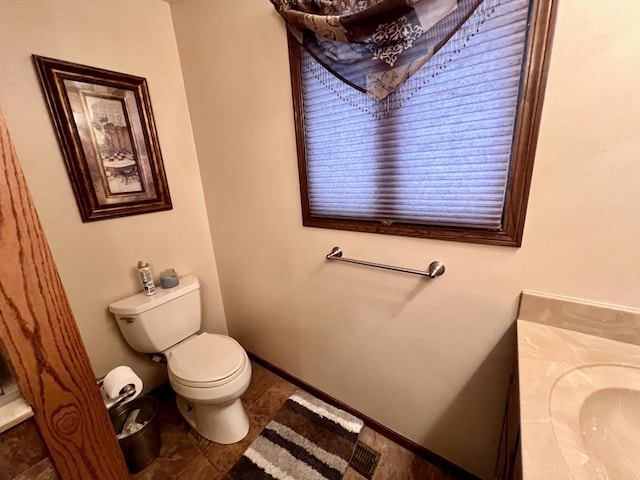 bathroom with tile patterned floors and toilet