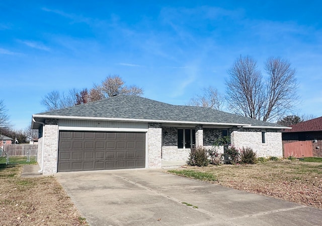 single story home featuring a front lawn and a garage