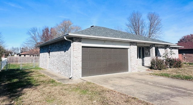 view of side of home with a garage