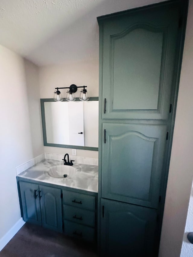 bathroom featuring vanity and a textured ceiling