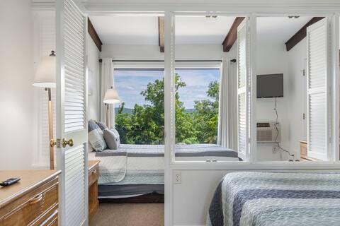 bedroom with beam ceiling and carpet floors