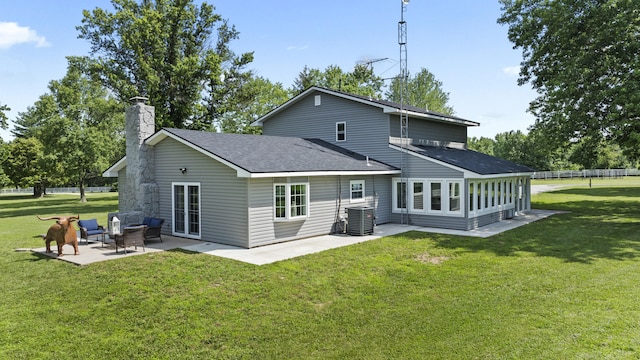 back of property with a yard, an outdoor hangout area, cooling unit, and a patio area