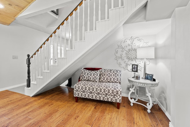 staircase with wood-type flooring