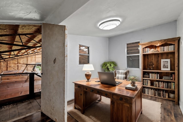 office area featuring dark hardwood / wood-style flooring and lofted ceiling