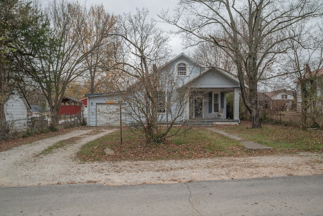 view of front of house featuring a garage and covered porch