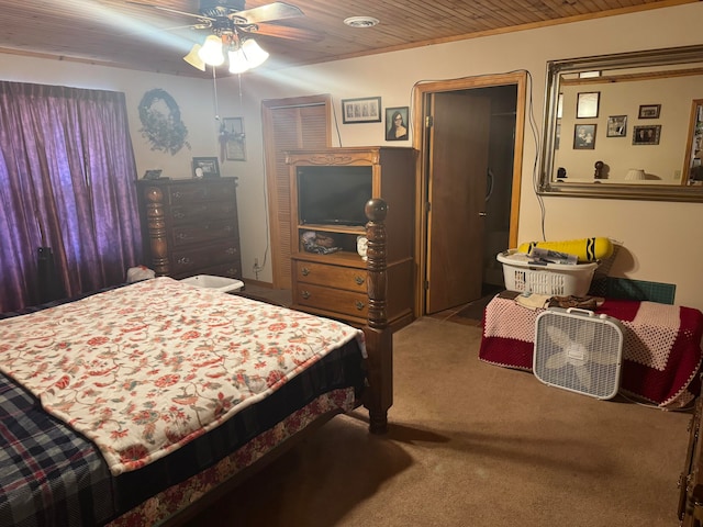 carpeted bedroom with a closet, ceiling fan, and wooden ceiling