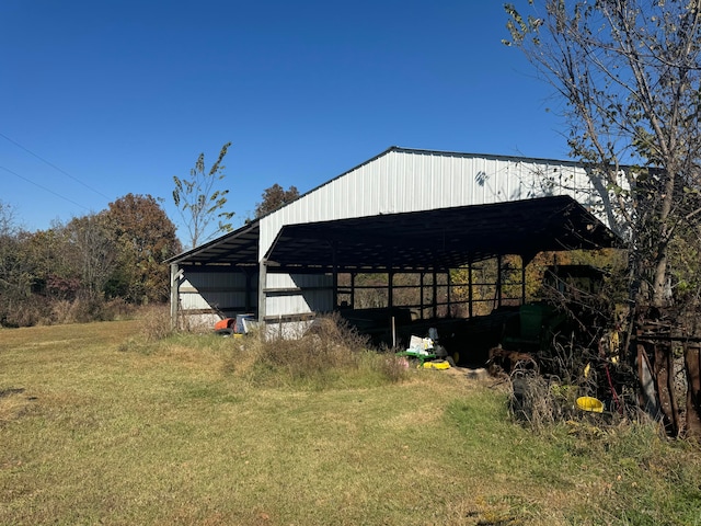 view of outbuilding featuring a yard