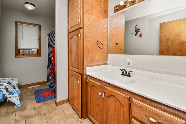 bathroom with vanity and toilet