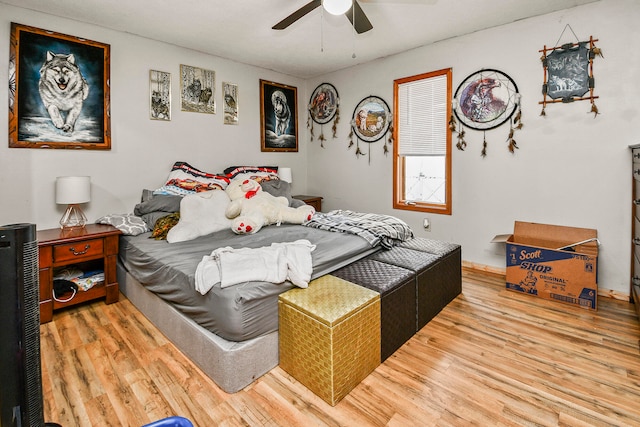 bedroom featuring ceiling fan and wood-type flooring