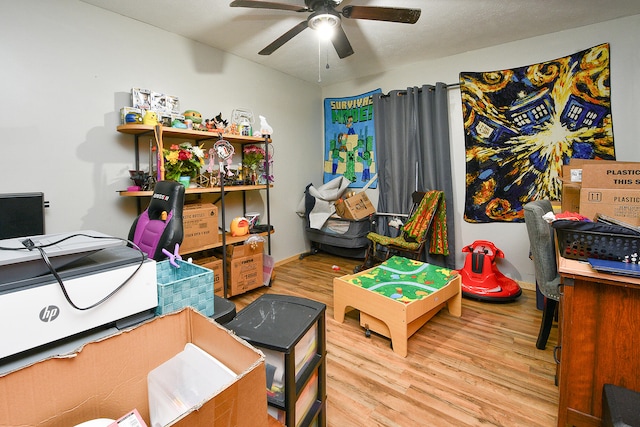 office with ceiling fan and light wood-type flooring