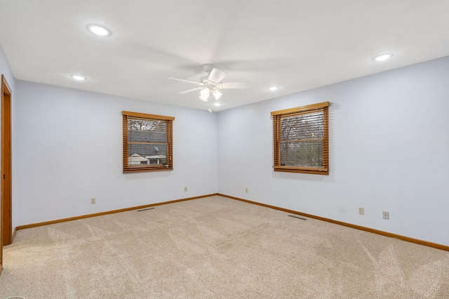 carpeted empty room with ceiling fan