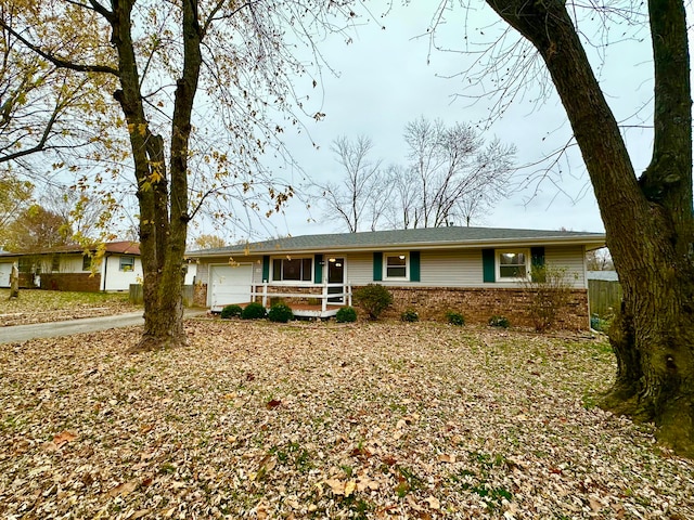 ranch-style house featuring a garage