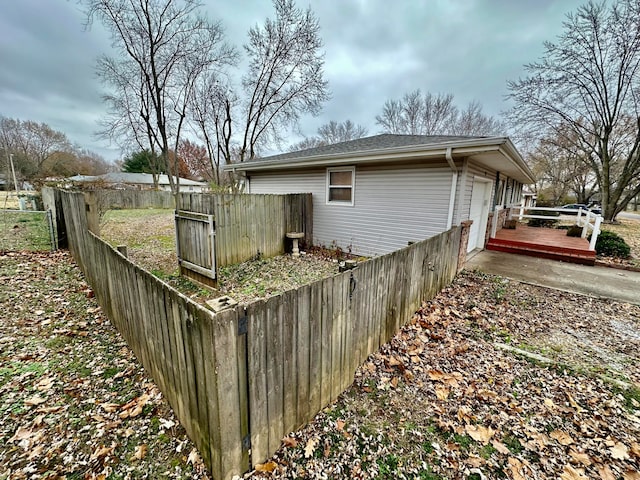 view of property exterior featuring a wooden deck