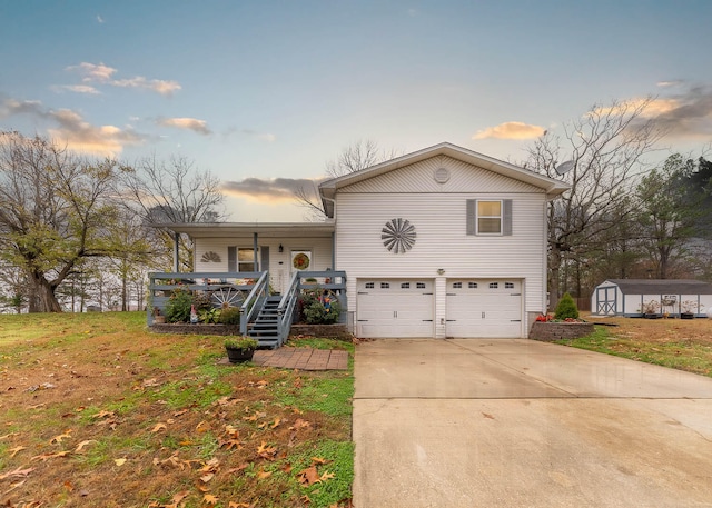 view of front of house with a lawn, a porch, a garage, and a storage shed