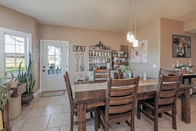 dining area with light tile patterned flooring