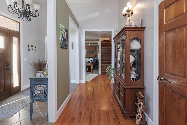 entrance foyer with a chandelier and hardwood / wood-style flooring