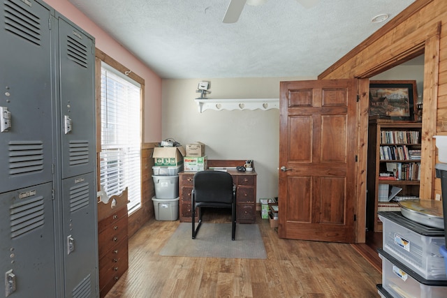 office featuring ceiling fan, a textured ceiling, and light hardwood / wood-style flooring