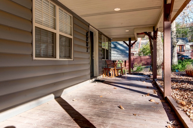 wooden terrace with a porch