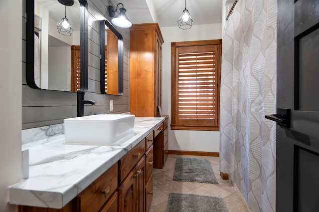 bathroom featuring tile patterned flooring and vanity