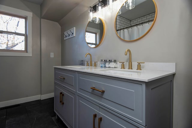 bathroom with tile patterned flooring and vanity