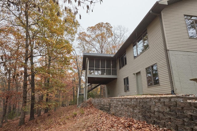 rear view of house with a sunroom