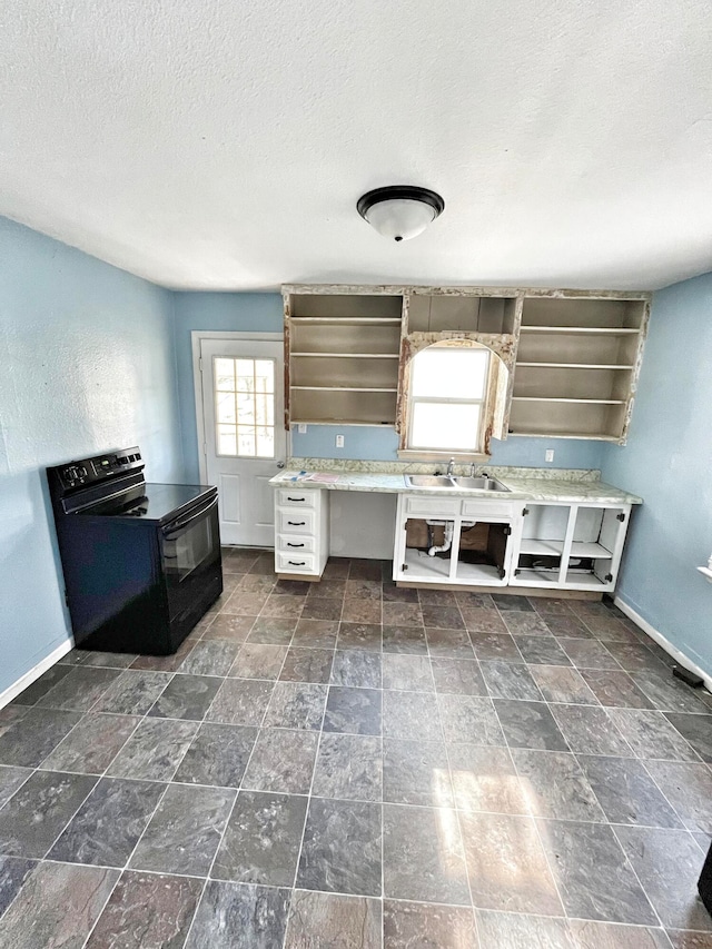 kitchen featuring electric range, baseboards, light countertops, open shelves, and a sink