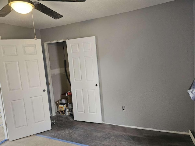 unfurnished bedroom featuring carpet flooring, a closet, and ceiling fan