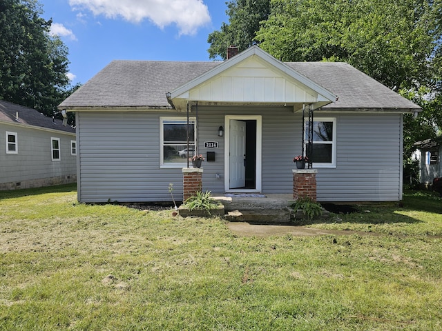 2114 E Cairo St, Springfield, MO 65802 - bungalow-style house with a front yard, roof with shingles, and covered porch