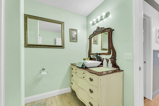 bathroom with vanity and wood-type flooring