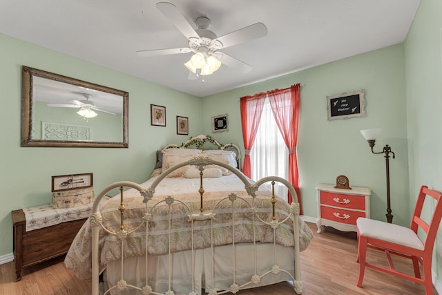 bedroom featuring light wood-type flooring and ceiling fan