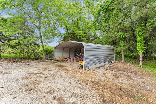 view of outbuilding with a carport