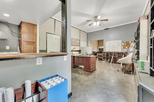 office featuring ceiling fan, concrete floors, and ornamental molding