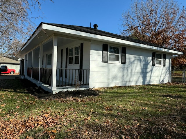 view of property exterior featuring a lawn