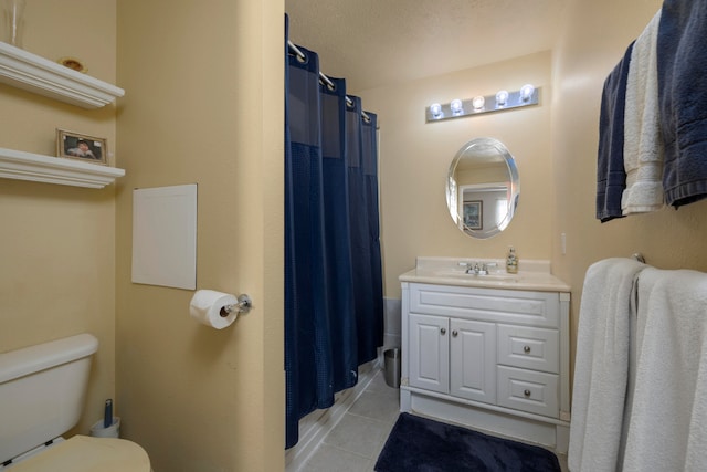 bathroom with tile patterned floors, vanity, toilet, and a shower with shower curtain