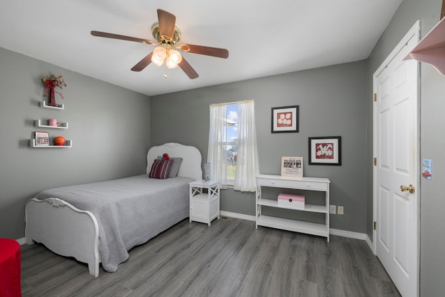 bedroom featuring hardwood / wood-style floors and ceiling fan