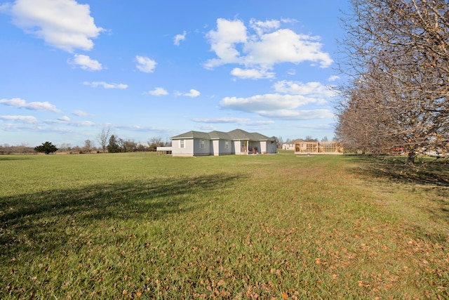 view of yard with a rural view