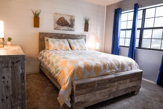 bedroom featuring dark colored carpet