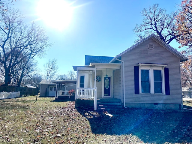 view of front of home with a front lawn and a porch