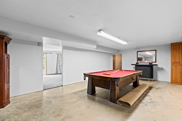 playroom featuring bar, a textured ceiling, and pool table