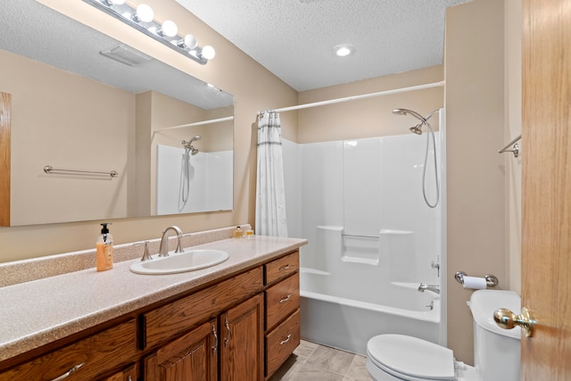 full bathroom with tile patterned floors, a textured ceiling, toilet, shower / bath combo with shower curtain, and vanity