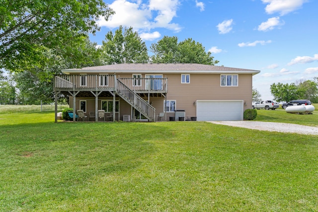 view of front facade with a garage, a deck, a front yard, and central AC