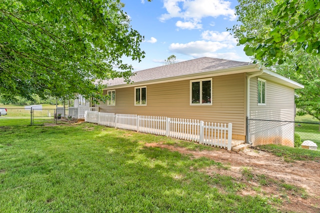 view of property exterior with a yard