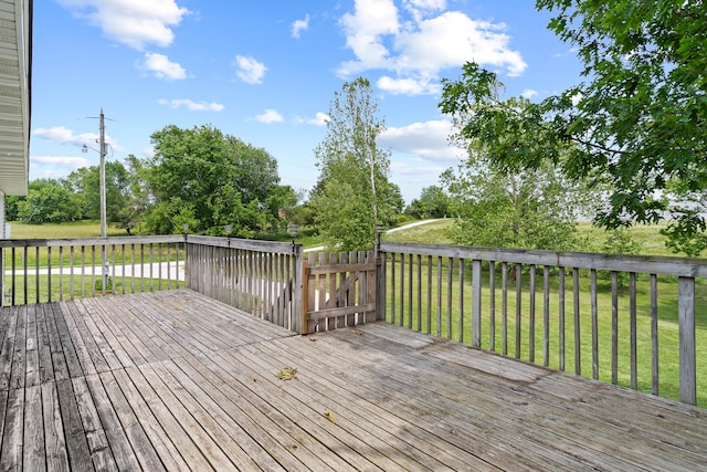 wooden deck with a yard