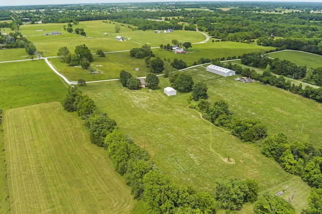 birds eye view of property with a rural view