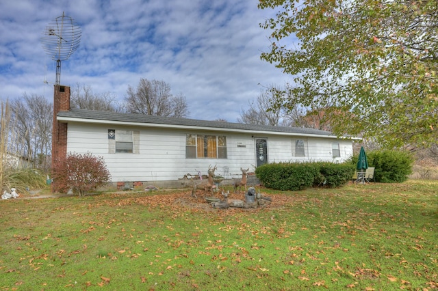 ranch-style home with a front lawn