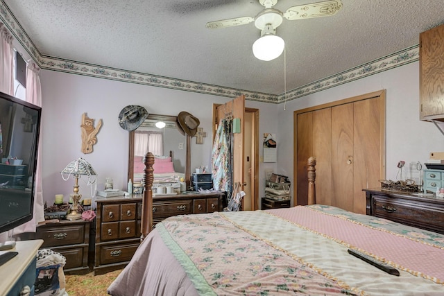 bedroom featuring ceiling fan, a closet, a textured ceiling, and multiple windows