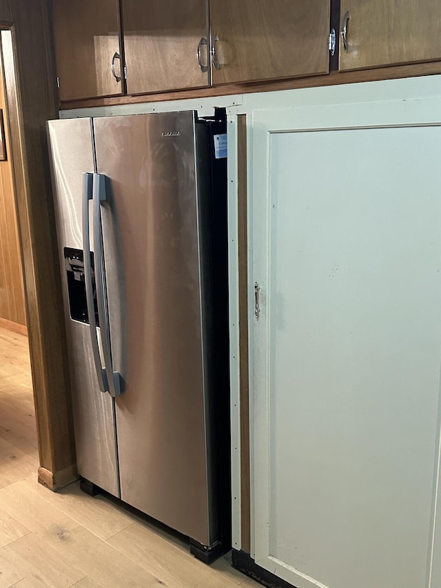 312 E Maple St, West Plains, MO 65775 - kitchen view of stainless steel fridge and light wood finished floors