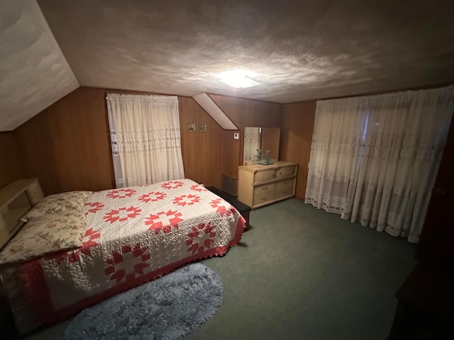 bedroom featuring carpet floors, a textured ceiling, and vaulted ceiling